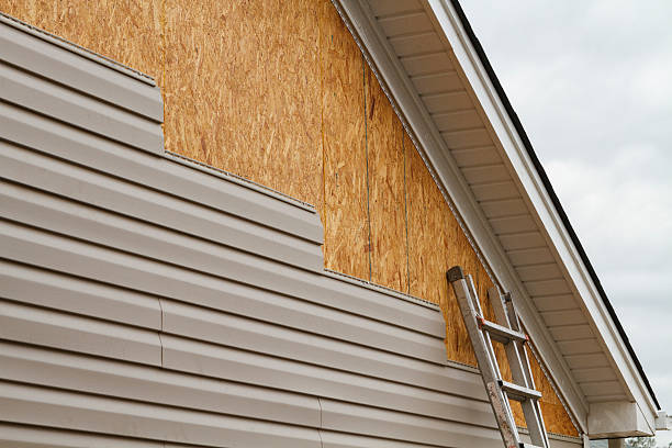 Professional Storm Damage Siding Repair technician working in Beach City, TX